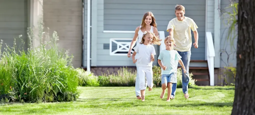 family running and playing outside